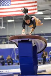 gymnast doing xcel vault on table