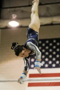 gymnast doing pirouette on Xcel platinum bars