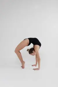 gymnast doing bridge in level 3 floor routine