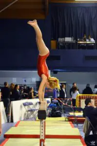 gymnast doing Level 3 beam dismount